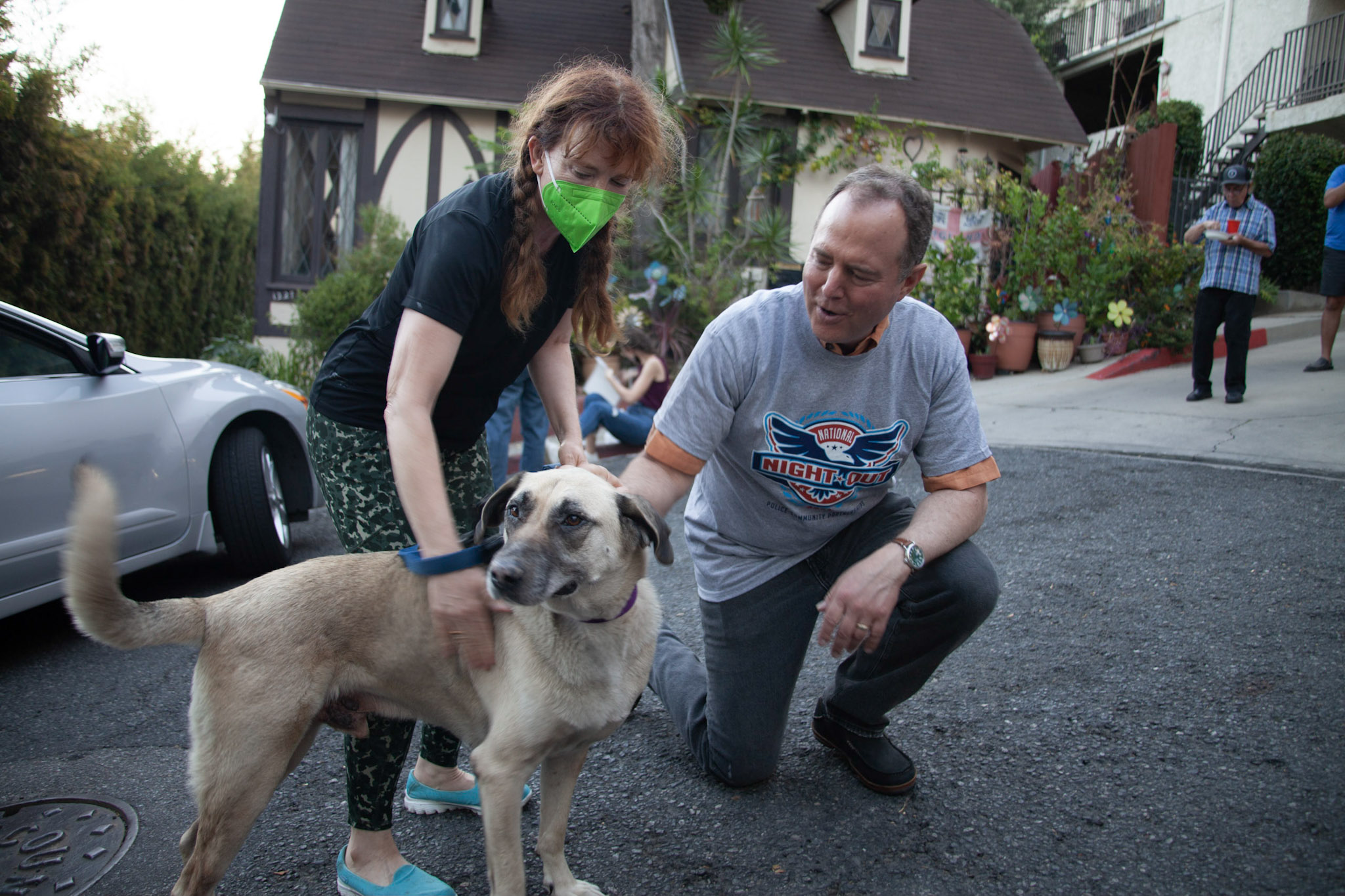 Adam Schiff petting a dog